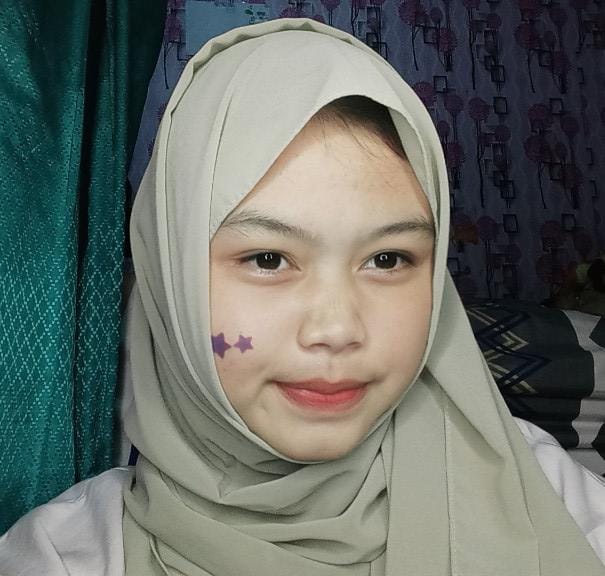 Clouds in shades of blue and gold at sunrise. 