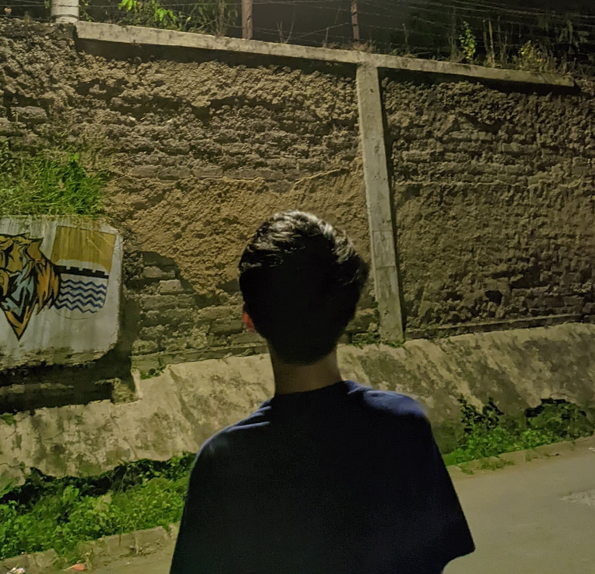 Low angle view up into a sky filled with deep blue clouds. 