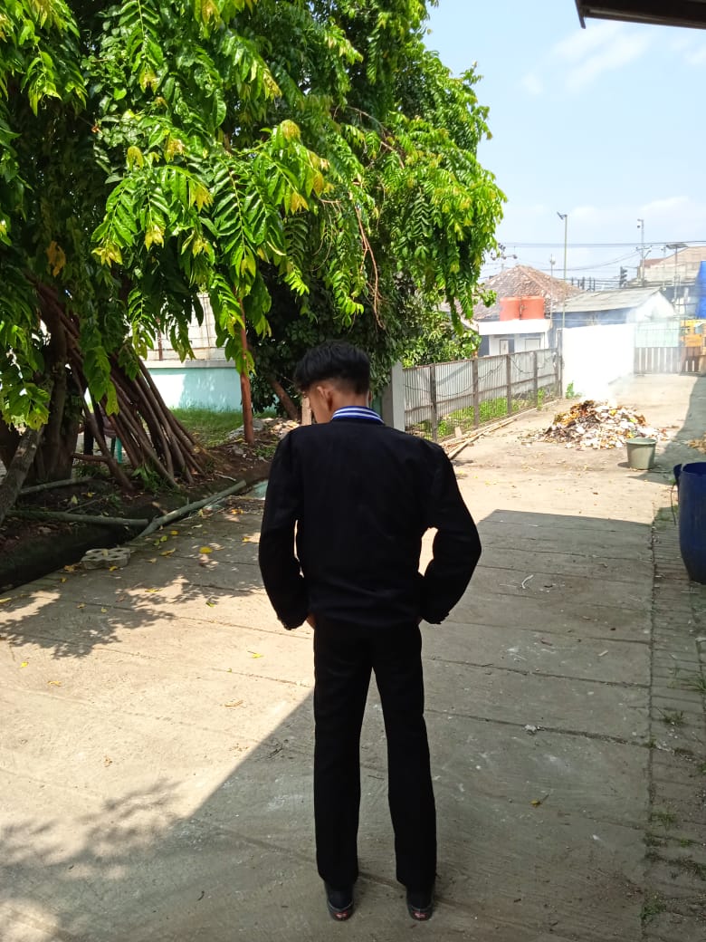 Low angle view up into a sky filled with deep blue clouds. 